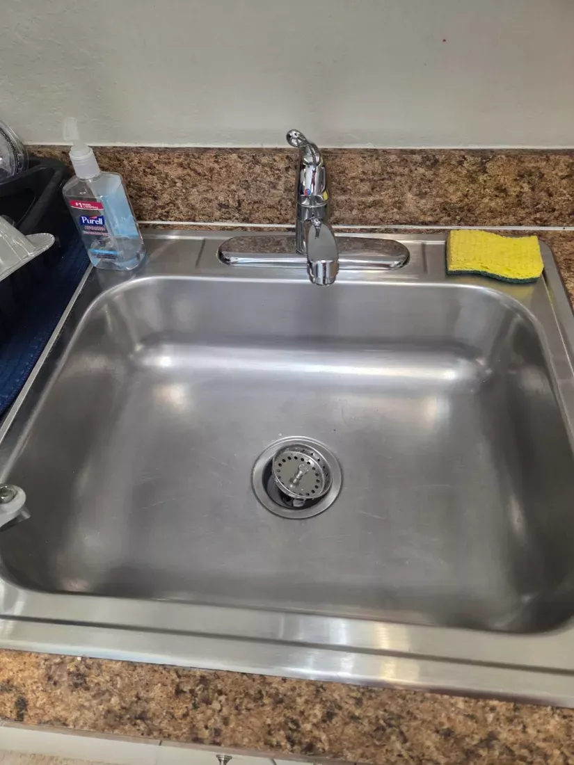 Office kitchen sink, faucet and counter wiped down and sanitised