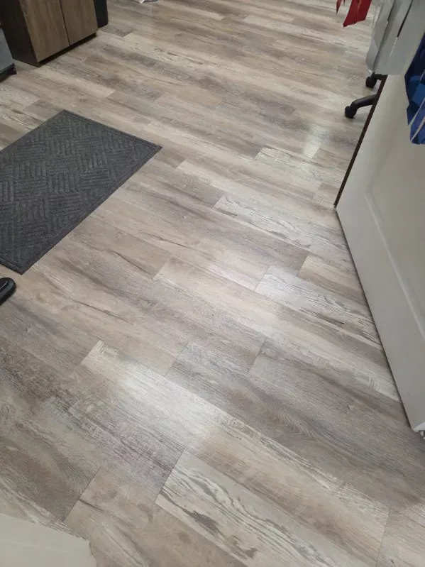 Office floor cleaned and the entry mat vacuumed and set back in place